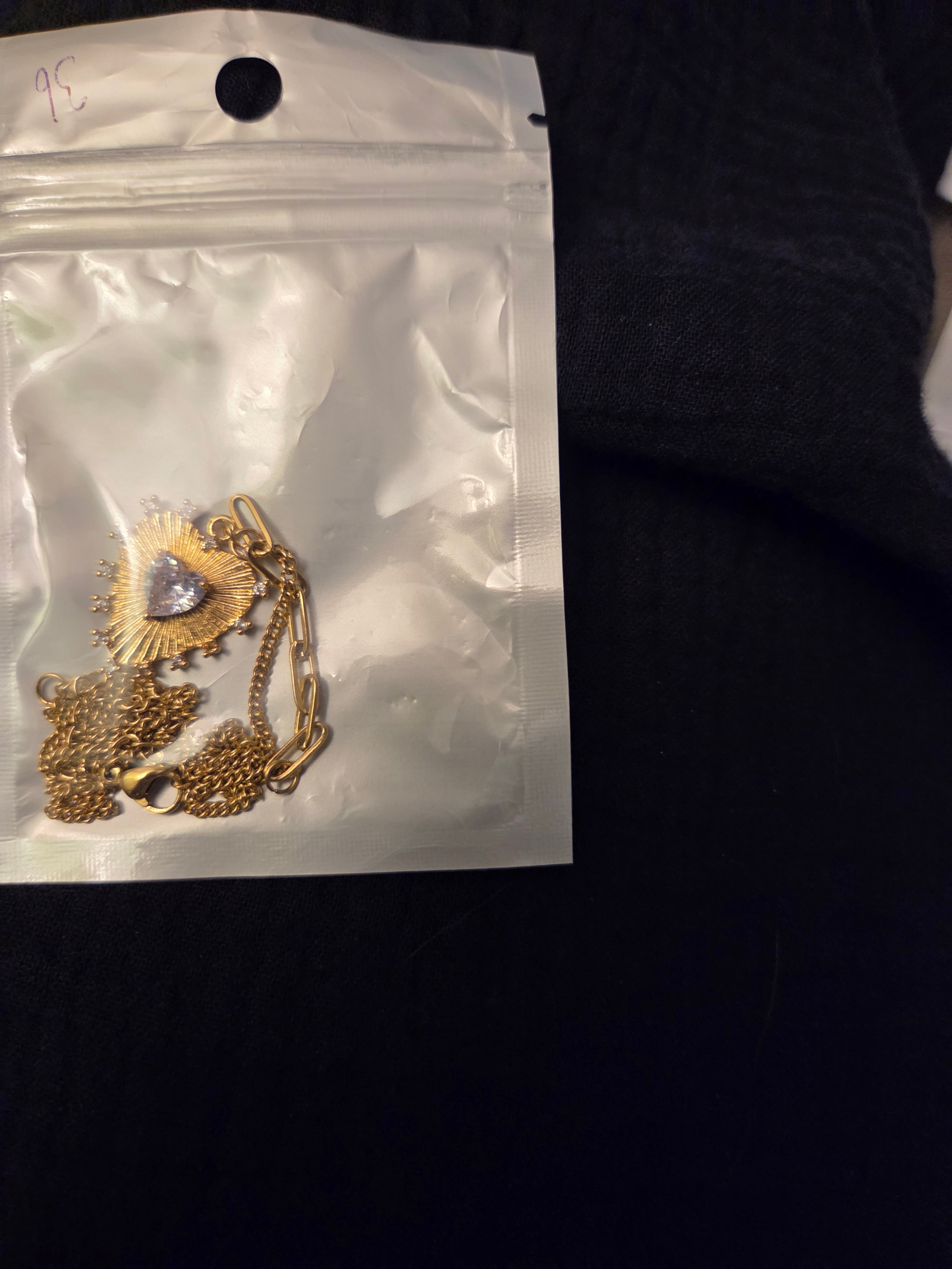 Gold Heart necklace with clear stones in middle