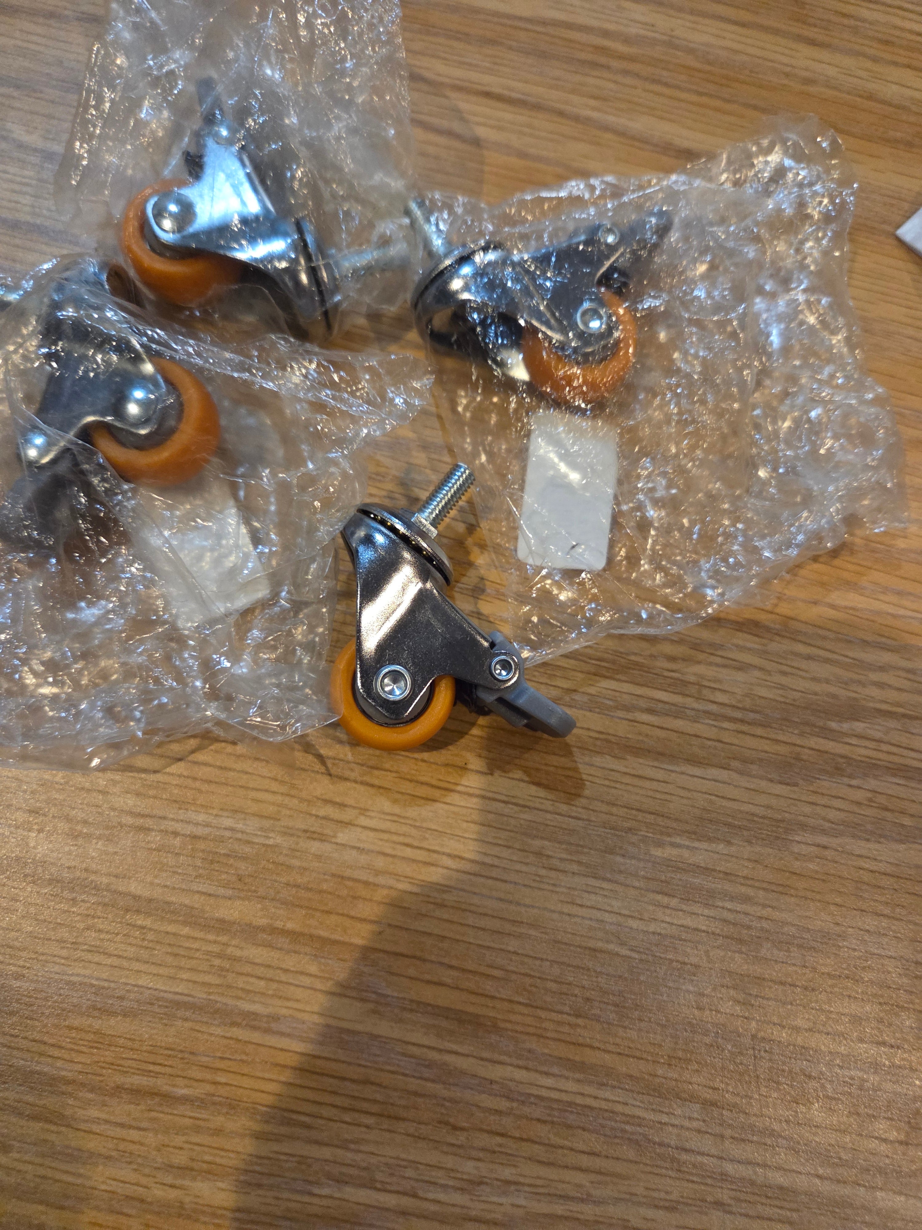 This is a swivel caster wheel with a threaded stem and brake.
